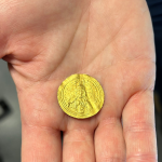 Hand holding ancient Byzantine coin