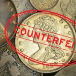 The word "Counterfeit" in red overlaid on a pile of coins.