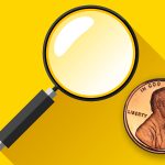 A magnifying glass focusing on a 1990-S "No S" cent against a yellow background