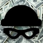 A mask over a pile of $100 bills