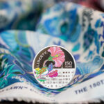 The Liberty commemorative coin on Liberty fabrics