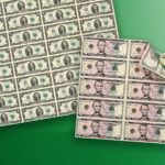 An uncut sheet of $5 and $2 notes with a price tag.