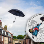 A black umbrella floating through the sky beside the Royal Mint Mary Poppins coin