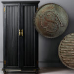 The facsimile Bar cent next to a black cabinet
