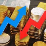 Up and down arrows with gold and silver in the background