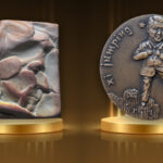 The Van Pallandt and Xi Jumping medals on gold podiums