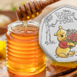 The Royal Mint Winnie the Pooh coin with a jar of honey